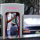 A Tesla owner charges their car in Beijing in July, 2018.